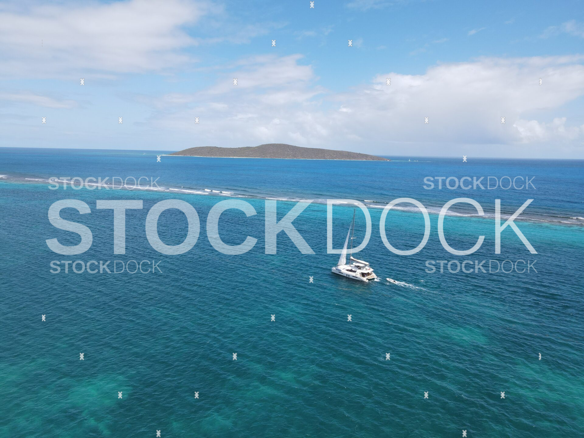 Sail boat in water with view of Buck Island